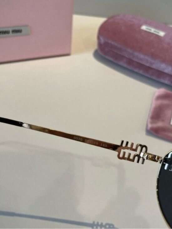 Miu Miu Gold Sunglasses with Black Lenses